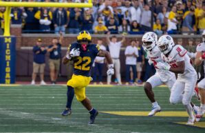 Michigan running back Justice Haynes bolts past New Mexico defenders on a 56-yard touchdown run on Saturday in Ann Arbor. (Tony Patroske/TPM)