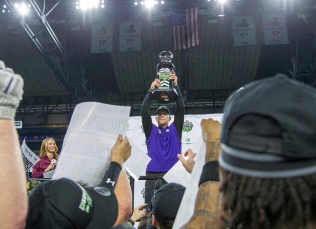 Northwestern coach David Braun holds up the GameAbove Sports Bowl trophy following the Wildcats' 34-7 win over Central Michigan at Ford Field in Detroit on Friday, Dec. 26, 2025. (Tony Patroske/TPM)