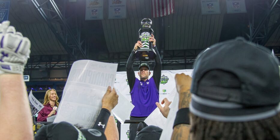 Northwestern coach David Braun holds up the GameAbove Sports Bowl trophy following the Wildcats' 34-7 win over Central Michigan at Ford Field in Detroit on Friday, Dec. 26, 2025. (Tony Patroske/TPM)