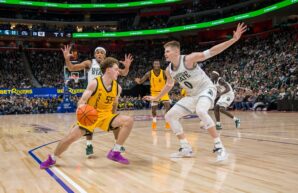 Oakland guard Brody Robinson is defended by Michigan State forward Jaxon Kohler on Saturday, December 20, 2025, at Little Caesars Arena in Detroit. The Spartans won, 79-70. (Tony Patroske/TPM)