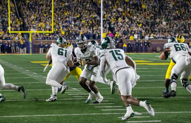 Michigan State quarterback Aidan Chiles hands the ball off during a game against Michigan in Ann Arbor in 2025. (Tony Patroske/TPM)