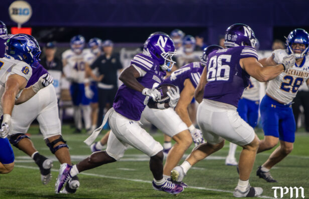 Northwestern running back Joseph Himon III sprints 80-yards to score in the closing minutes of Saturday's 34-18 win over South Dakota State. (Damien Dennis/TPM)